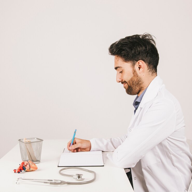 smiley doctor sitting his desk writing_23 2147646739